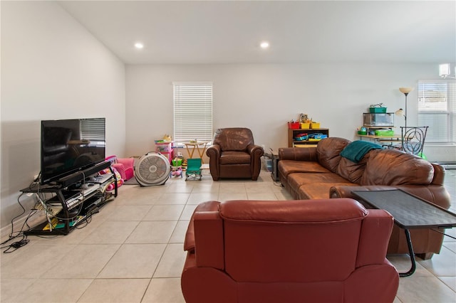 living room with recessed lighting and light tile patterned flooring