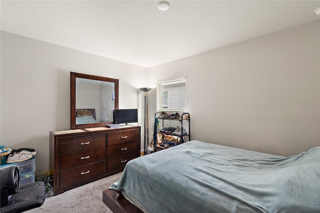 bedroom featuring light carpet