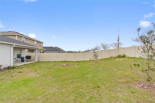 view of yard featuring a fenced backyard and a patio