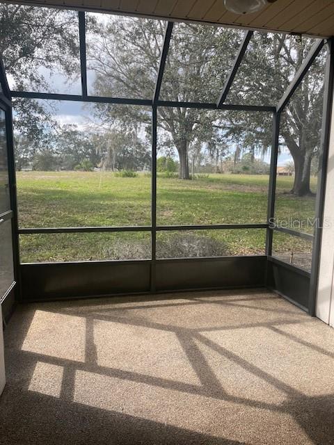 unfurnished sunroom with plenty of natural light