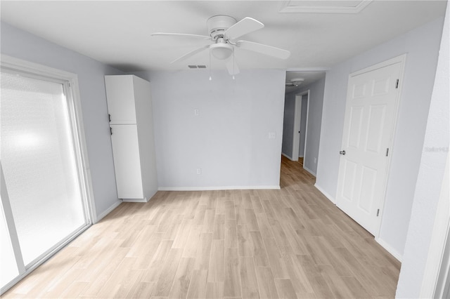 unfurnished bedroom featuring light wood-type flooring and ceiling fan