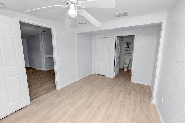 spare room with ceiling fan and light hardwood / wood-style flooring