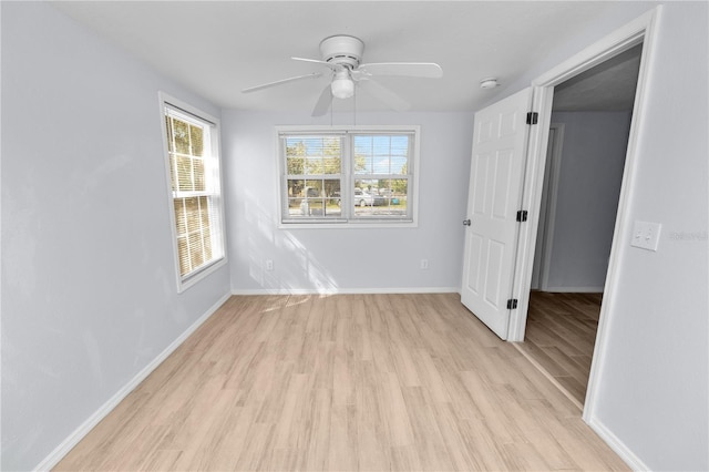 spare room featuring ceiling fan and light wood-type flooring