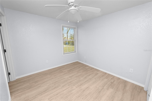 spare room featuring ceiling fan and light wood-type flooring