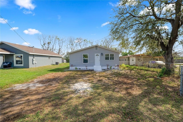 back of property with a yard and cooling unit