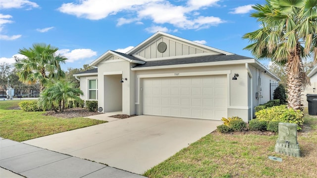 view of front of house with a front yard and a garage