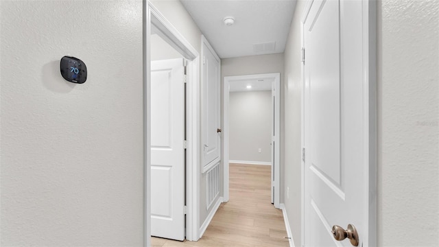 hallway featuring light hardwood / wood-style flooring