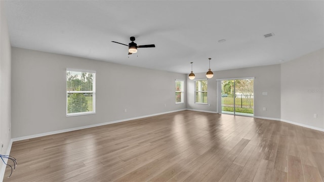 unfurnished room featuring light hardwood / wood-style flooring and ceiling fan