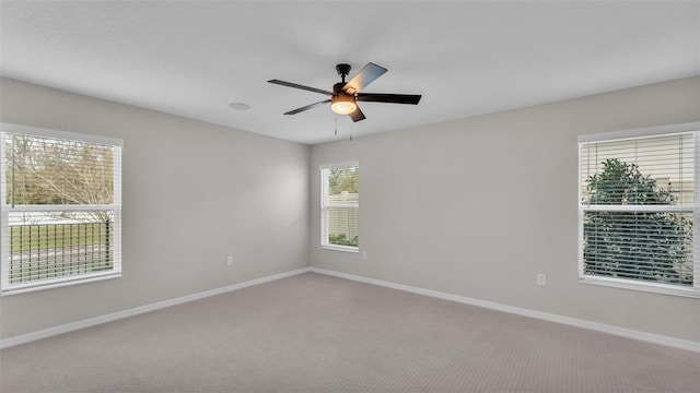 carpeted empty room with ceiling fan