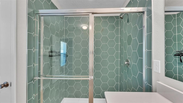 bathroom featuring an enclosed shower