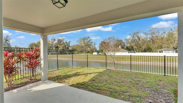 view of yard featuring a patio and a water view