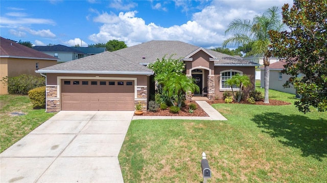 ranch-style home with a garage, stone siding, driveway, and a front lawn