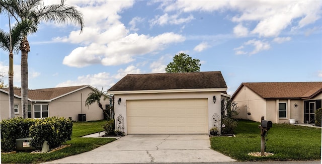 ranch-style house with a front yard, central AC unit, and a garage