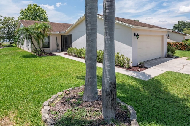 3976 Cypress Lndg W, Winter Haven, FL 33884 - view of side of property with driveway, an attached garage, a yard, and stucco siding