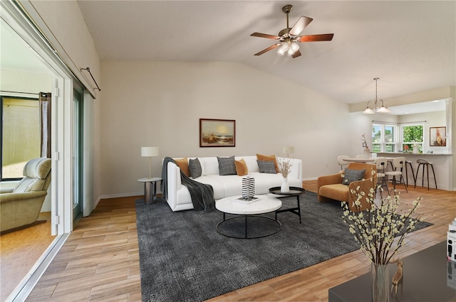 3976 Cypress Lndg W, Winter Haven, FL 33884 - living room with light wood-style flooring, a ceiling fan, and vaulted ceiling