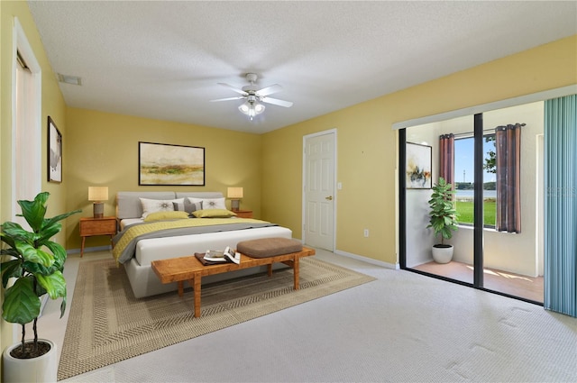 3976 Cypress Lndg W, Winter Haven, FL 33884 - carpeted bedroom featuring access to exterior and ceiling fan