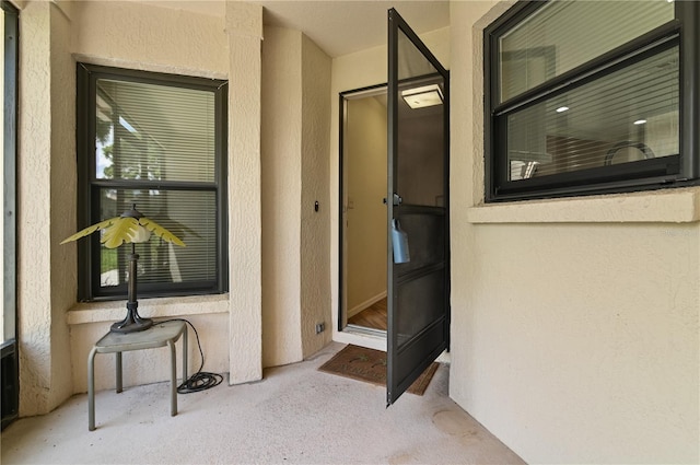 3976 Cypress Lndg W, Winter Haven, FL 33884 - view of exterior entry featuring stucco siding