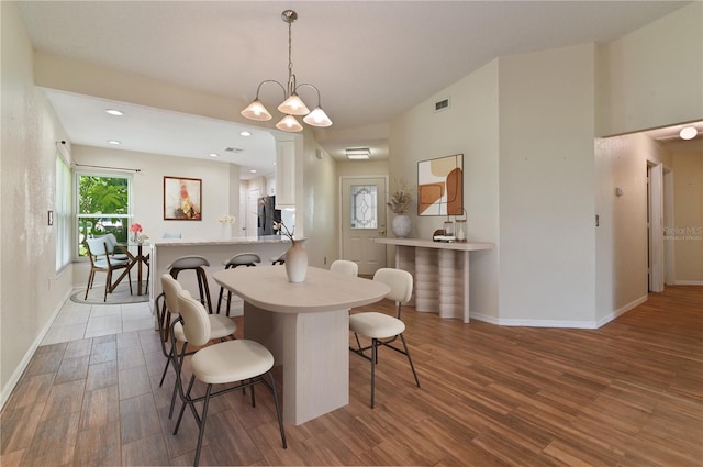 3976 Cypress Lndg W, Winter Haven, FL 33884 - dining room with wood finished floors, plenty of natural light, and recessed lighting