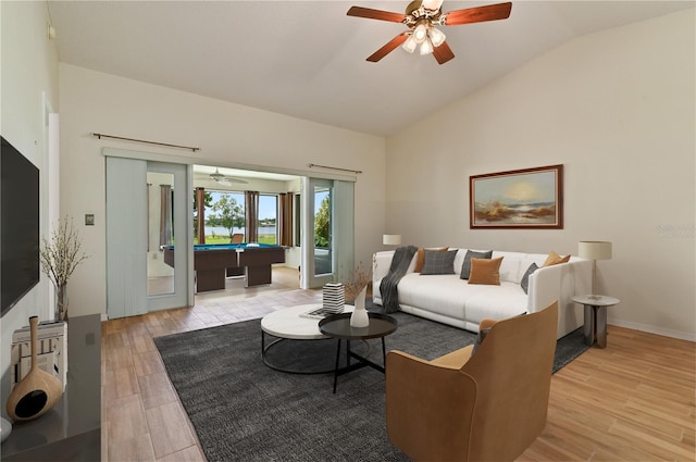 3976 Cypress Lndg W, Winter Haven, FL 33884 - living room with billiards table, lofted ceiling, a ceiling fan, and light wood-style flooring