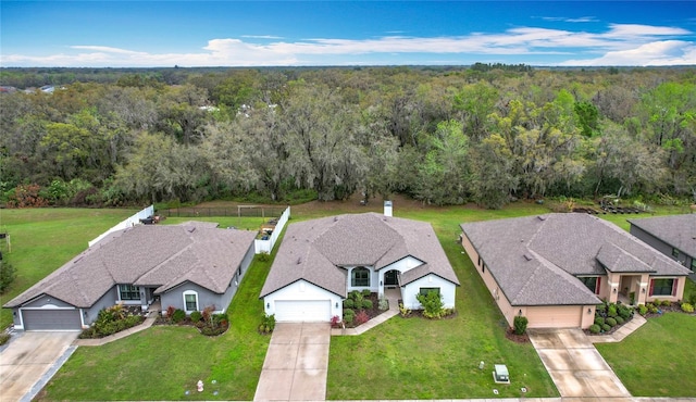 drone / aerial view with a view of trees