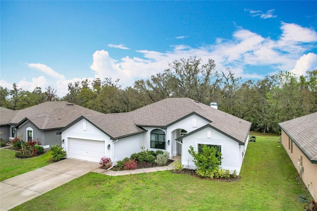 ranch-style home with an attached garage, concrete driveway, roof with shingles, stucco siding, and a front yard