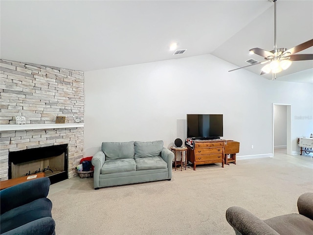 living room featuring visible vents, light carpet, vaulted ceiling, a stone fireplace, and ceiling fan