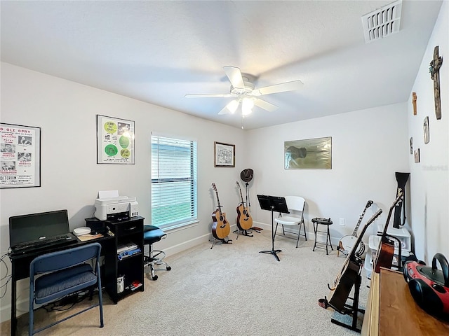 office space with baseboards, visible vents, ceiling fan, and carpet flooring