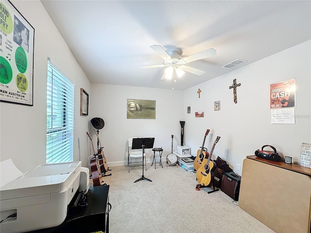 playroom with a ceiling fan, light colored carpet, visible vents, and baseboards