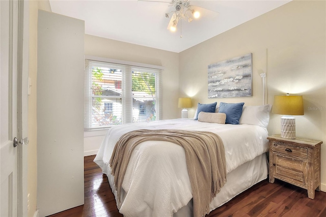 bedroom with dark wood-style flooring