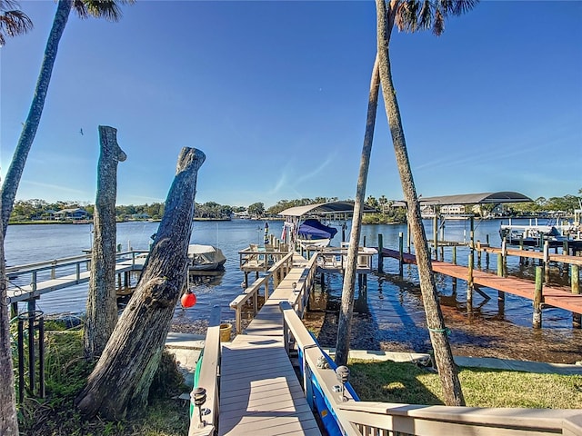 view of dock with a water view and boat lift