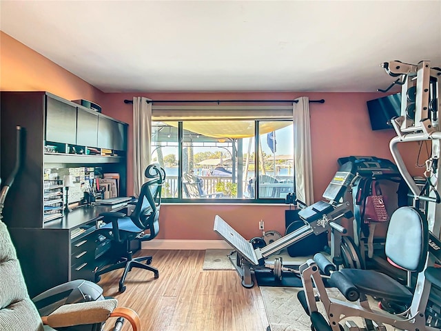 home office featuring light wood finished floors and baseboards