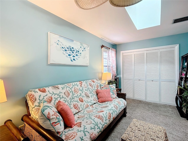 living room with a skylight, carpet, and visible vents