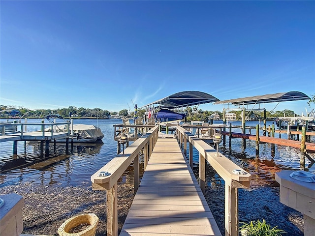 view of dock featuring a water view and boat lift