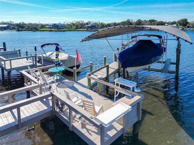 view of dock with a water view and boat lift