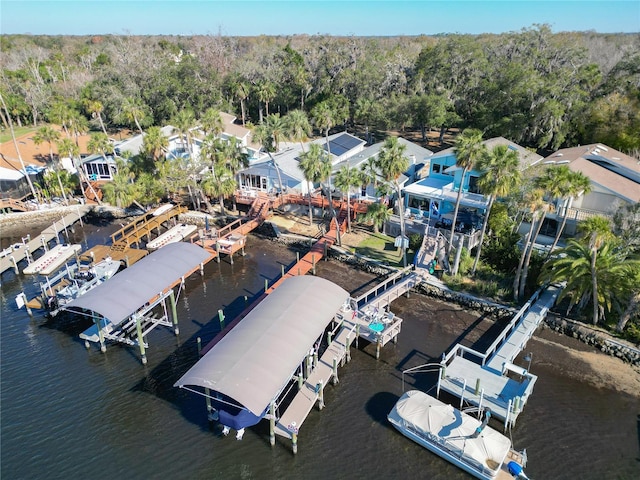 aerial view with a water view, a residential view, and a view of trees