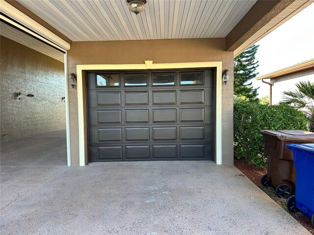 394 Nolane Ln, Polk City, FL 33868 - garage with concrete driveway