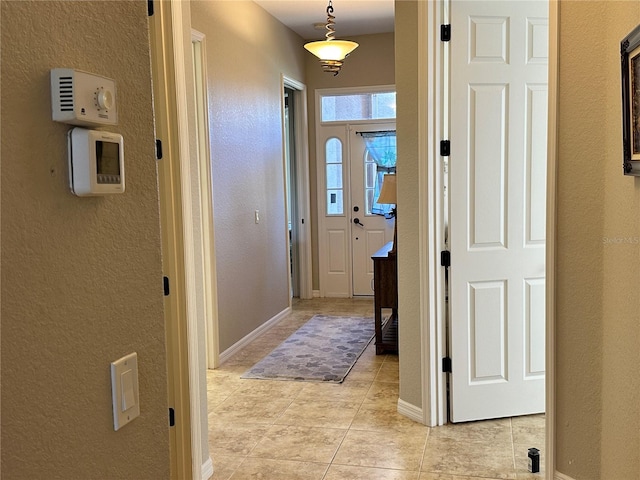 394 Nolane Ln, Polk City, FL 33868 - interior space with light tile patterned floors, baseboards, and a textured wall