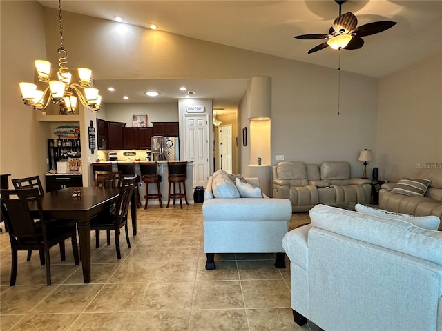394 Nolane Ln, Polk City, FL 33868 - living room featuring ceiling fan with notable chandelier, high vaulted ceiling, light tile patterned flooring, and recessed lighting