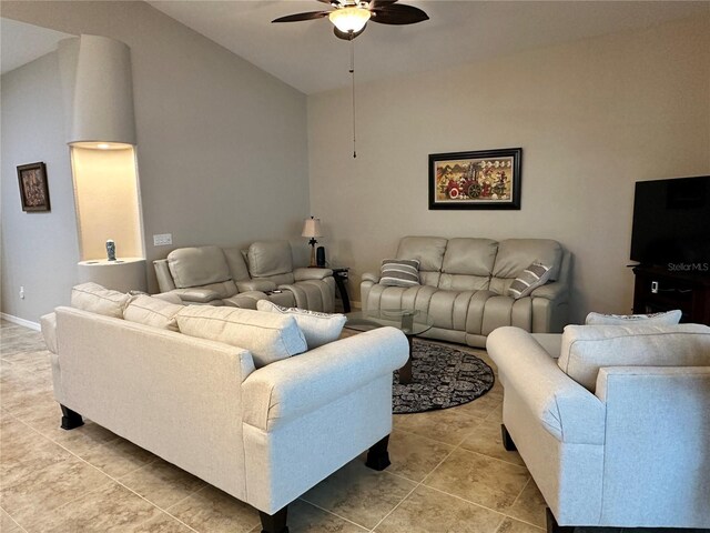 394 Nolane Ln, Polk City, FL 33868 - living room featuring vaulted ceiling, tile patterned floors, a ceiling fan, and baseboards