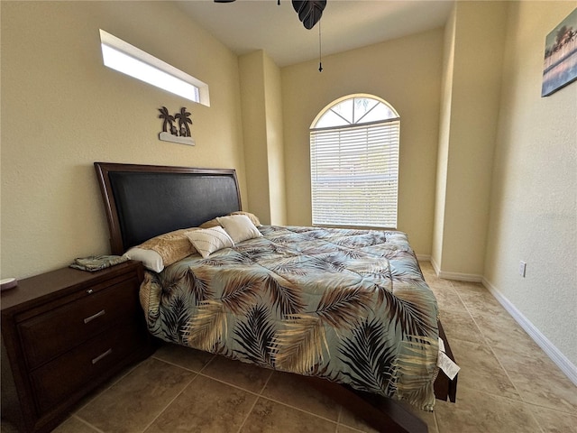 394 Nolane Ln, Polk City, FL 33868 - bedroom with a ceiling fan, multiple windows, baseboards, and light tile patterned floors