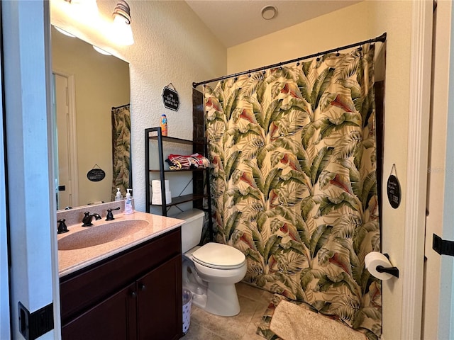 394 Nolane Ln, Polk City, FL 33868 - full bathroom with a textured wall, toilet, a shower with curtain, tile patterned flooring, and vanity