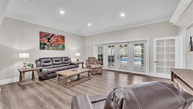 living room featuring ornamental molding, french doors, baseboards, and wood finished floors