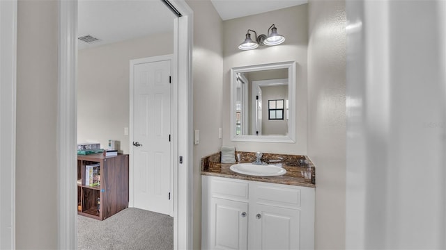 bathroom with visible vents and vanity