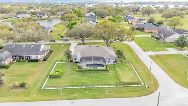 bird's eye view featuring a residential view and a water view