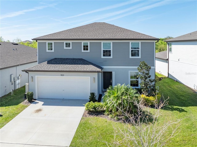 traditional-style home with a garage, a front lawn, concrete driveway, and roof with shingles