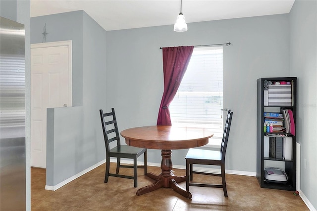 dining space featuring baseboards