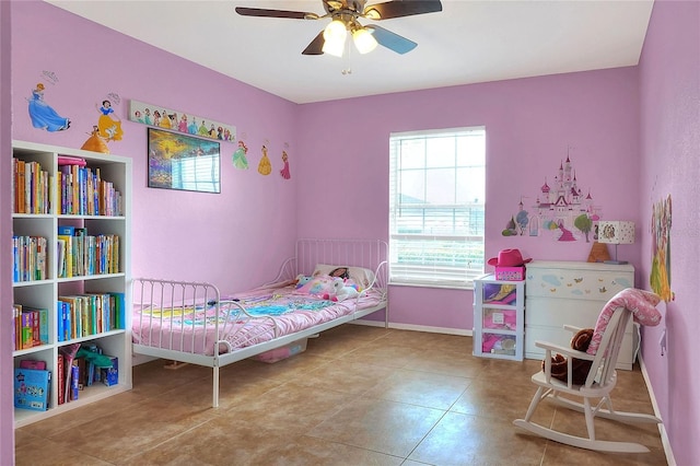 bedroom featuring a ceiling fan, baseboards, and tile patterned floors