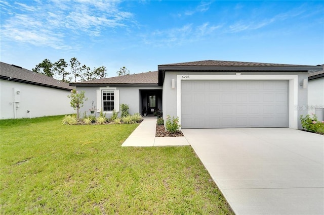 single story home featuring an attached garage, driveway, a front yard, and stucco siding