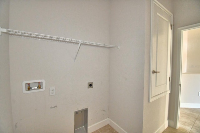 washroom with laundry area, washer hookup, hookup for an electric dryer, and light tile patterned flooring