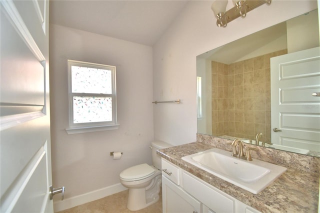 full bath featuring tile patterned flooring, toilet, vanity, baseboards, and vaulted ceiling